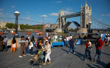 London - People on the Southbank watching Tower Bridge being raised. Photo Credit: ©Pawel Libera/Visit London Images.