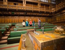 Palace of Westminster - Part view of ornate Victorian gothic architecture of the iconic Big Ben clock tower at the Houses of Parliament, designed by Sir Charles Barry and Augustus Pugin.