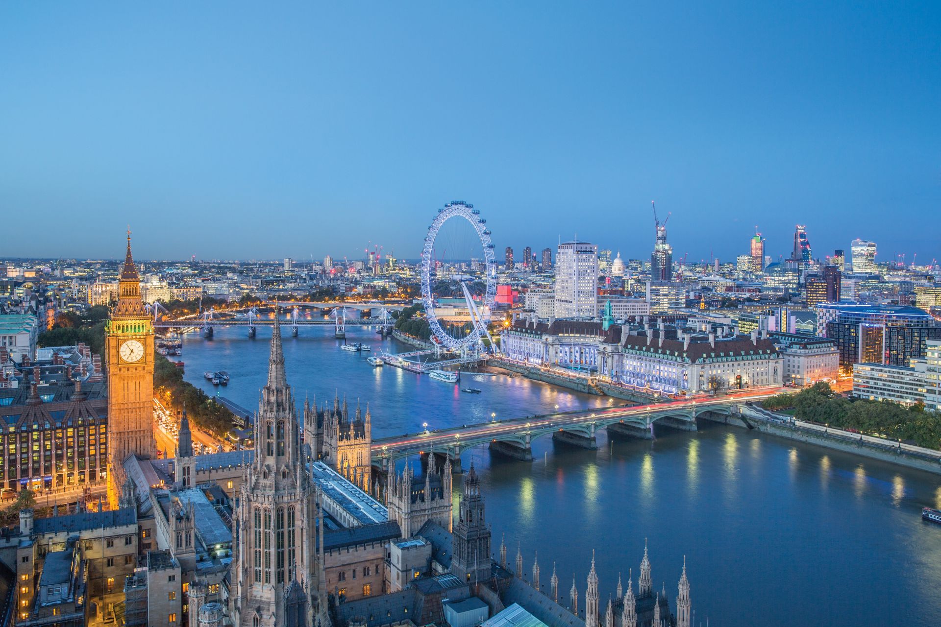 London skyline with Big ben and the London Eye at dusk. Photo Credit: © Julian Love/Visit London Images.