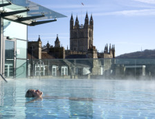 Bath - Woman relaxing in the New Royal Bath at Thermae Bath Spa, Britain's original and only thermal bath spa set in the busy city of Bath, England., Bath, Bath and North East Somerset, England.