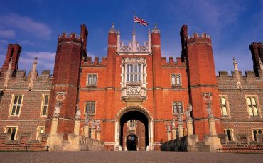 Hampton Court Palace - The bridge over the moat leads to the Tudor west front, which is protected by the King's Beasts.