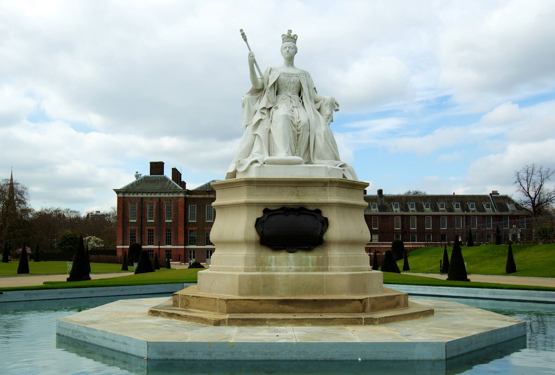 In front of the east front public entrance stands a statue of Queen Victoria, sculpted by her daughter Princess Louise.