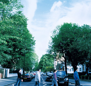 London - Four people using the Zebra Crossing on Abbey road. Photo Credit: ©Jasmine Teer/Visit London Images.