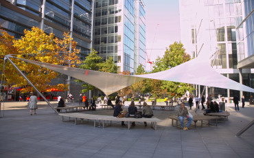 London - People sitting and chatting at an outdoor seating area in Spitalfields. Photo Credit: ©Pawel Libera/Visit London Images.