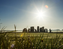 Stonehenge is a UNESCO world heritage site, and a prehistoric ring of huge standing stones within an earthworks, on the plains in Wiltshire.