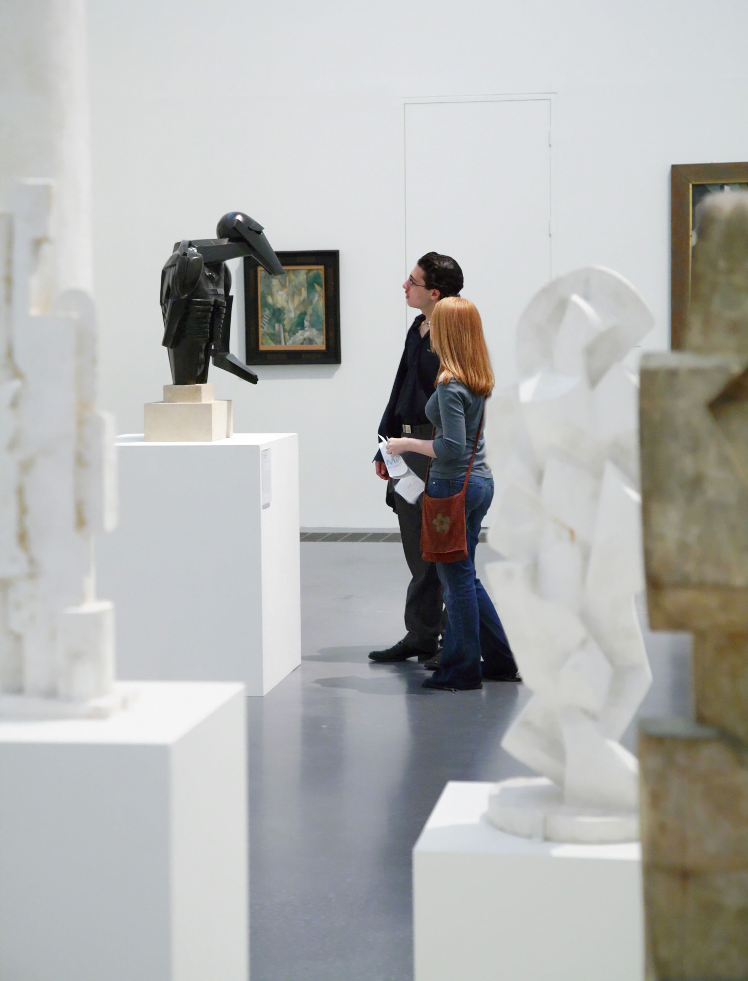 Couple looking at sculpture in the Tate Modern gallery, the national collection of modern and contemporary art housed in a former power station at Bankside, London.