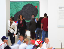 Group of school children and visitors looking at paintings in the Tate Modern gallery, the national collection of modern and contemporary art housed in a former power station at Bankside, London.