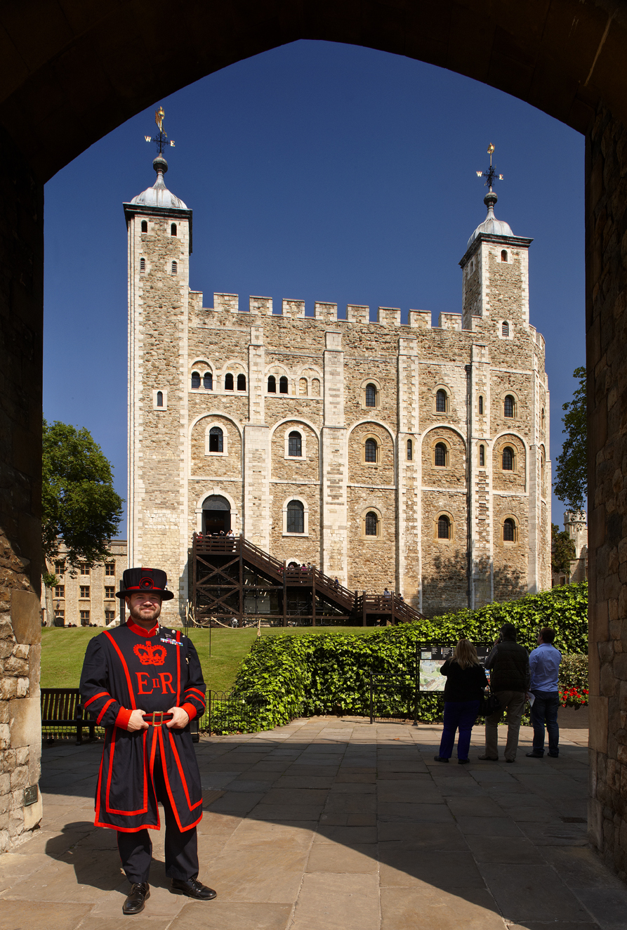 Tower of London - White Tower and Yeoman Warder Shedden. The White Tower was the original Tower of London. Begun by William the Conqueror around 1080, it would have made a safe and impressive home for the newly crowned Norman invader. During its long life - it is almost as old as the Millennium - it has served many purposes including Royal residence, Royal Observatory, Public Records Office, State Prison, gunpowder store and is still home to the Royal Armouries.