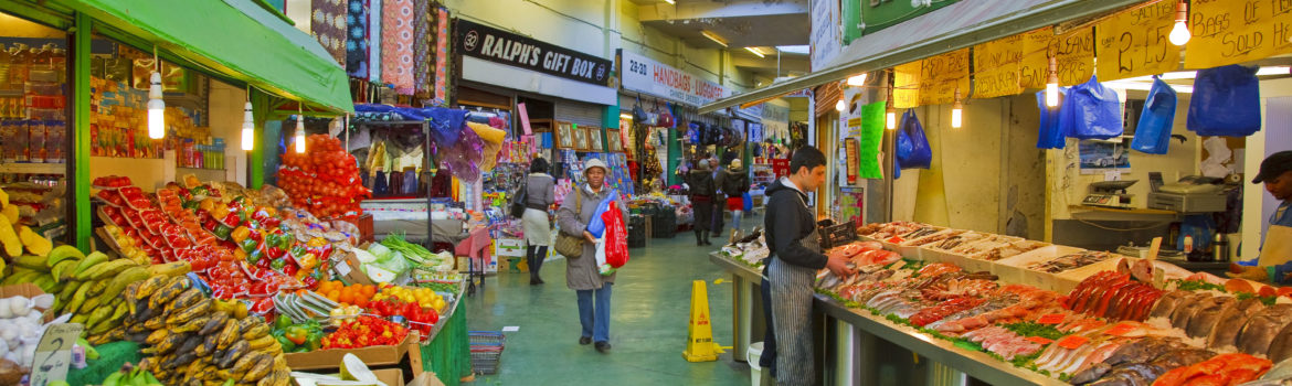 Brixton Market - assorted food for sale. Photo Credit: ©Visit London Images/Kool Runnings Ice Gold Green Boutique in Brixton. Photo Credit: ©Visit London Images/Pawel Libera.