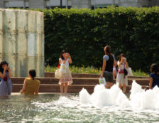 People at a water feature in Cabot Place, near Canary Wharf in the Docklands. Photo Credit: ©Visit London Images.