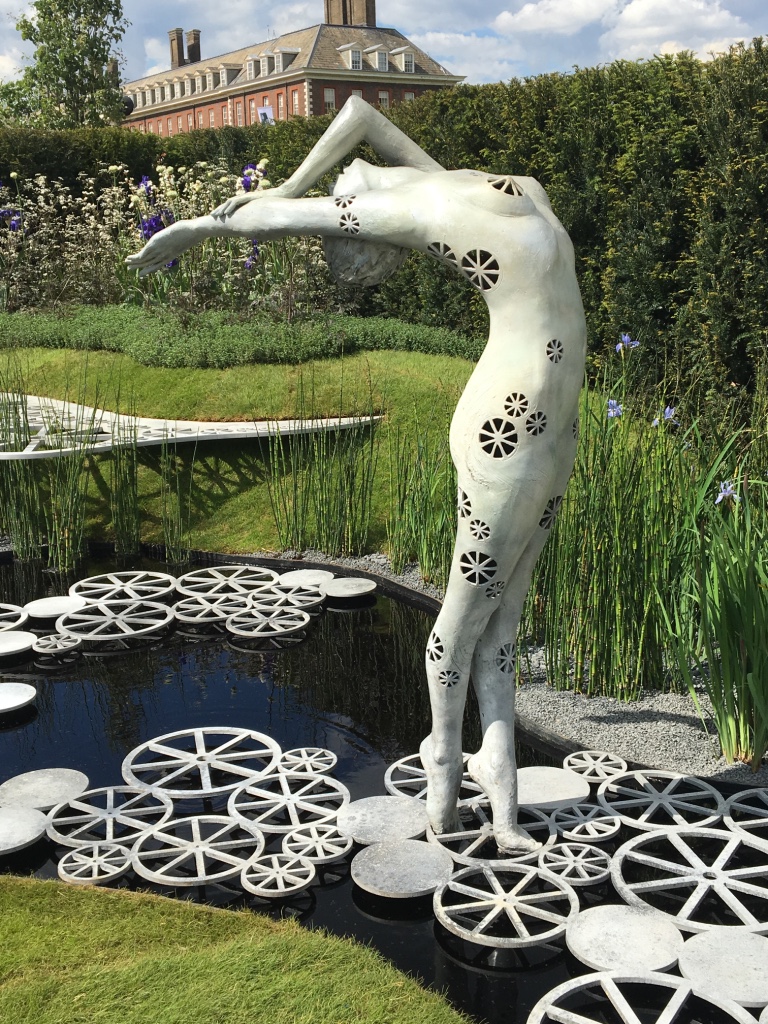 2016 Chelsea Flower Show: Arching Bronze Figuarative Water Feature_River of Time created by Ukrainian sculptor Victoria Chichinadze. Photo Credit: ©Ursula Petula Barzey.