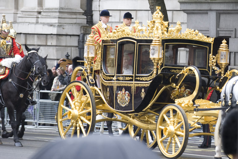 Queen Elizabeth II and Prince Philip on Whitehall, on their way to the Houses of Parliament. Photo Credit: ©Crown Copyright.