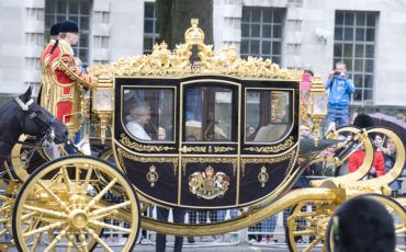 Queen Elizabeth II and Prince Philip on Whitehall, on their way to the Houses of Parliament. Photo Credit: ©Crown Copyright.