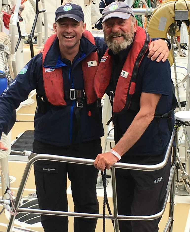 Skipper Greg Miller with Blue Badge Tourist Guide Brian Harlock on return from round the world sailing trip. Photo Credit: ©Liz Rubenstein. 