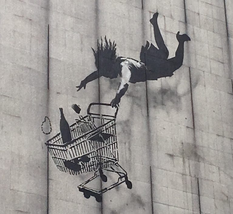 London Street Art: Banksy - A woman and her shopping trolley falling from a great height. Photo Credit: © Ursula Petula Barzey.