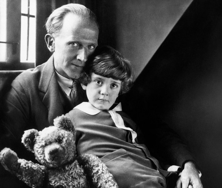 Milne with his son Christopher Robin and Pooh Bear, at Cotchford Farm, their home in Sussex. Photo Credit: © Howard Coster, 1926.