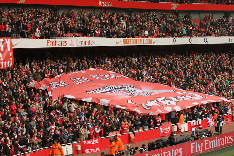 London Football: Arsenal Supporters with Flag.