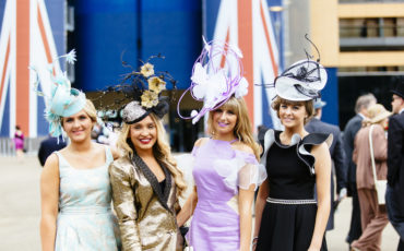 Four young women attending Royal Ascot at the prestigious Ascot racecourse in Berkshire. Photo Credit: © Ben Selway via Visit Britain.