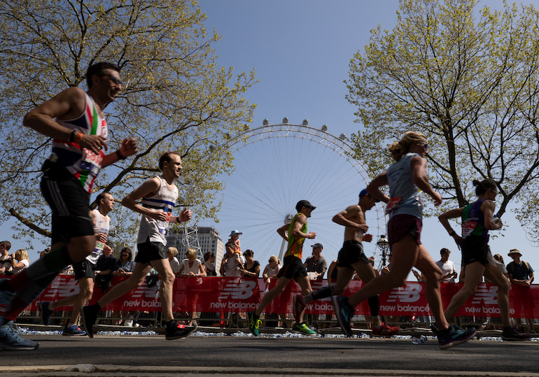 Runners pass the London Eye during the 2018 Virgin Money London Marathon. Photo Credit: © Ian Walton for Virgin Money London Marathon.