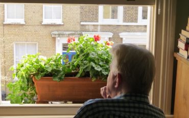 Steve looking out the window on Chisenhale Road, Bow, East London. Photo Credit: © Steve Fallon.