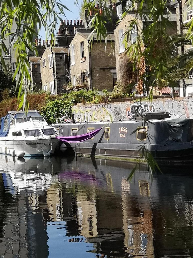 Boats with hammock moored along the Hertford Union Canal, Bow, East London. Photo Credit: © Steve Fallon.