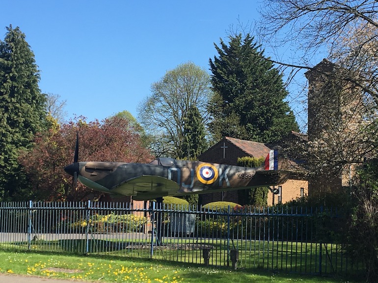 Spitfire in front of St George's Royal Air Force Chapel of Remembrance Biggin Hill. Photo Credit: © Ursula Petula Barzey.