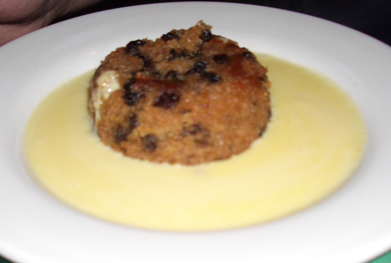 Spotted Dick and custard. Photo Credit: © Justinc via Wikimedia Commons.