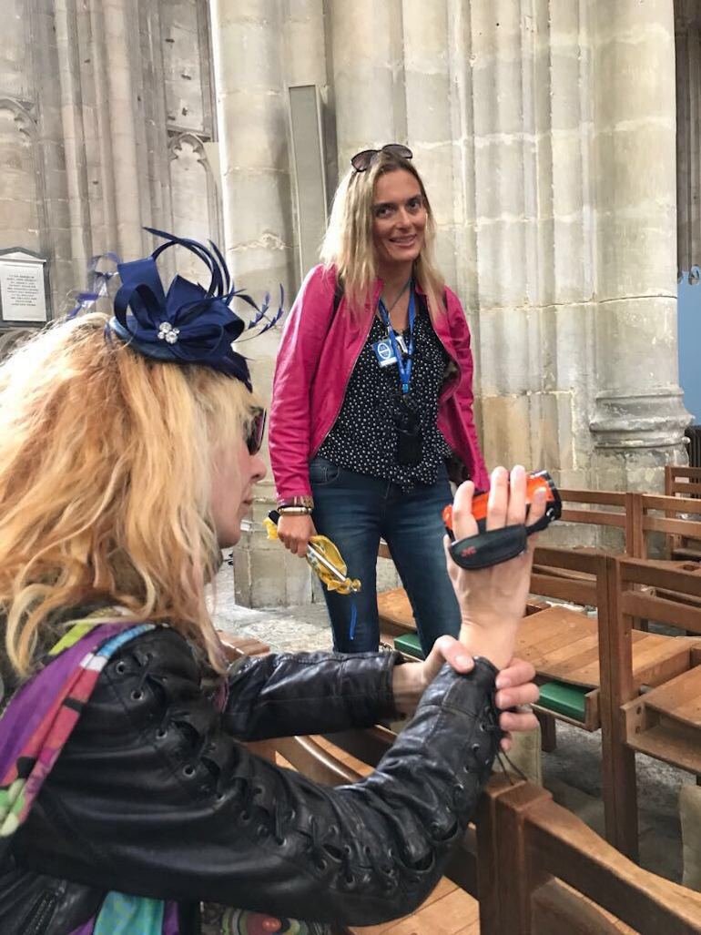 Blue Badge tourist guide Olga Romano is being filmed by a tourist inside Gloucester Cathedral. Photo Credit: © Olga Romano.