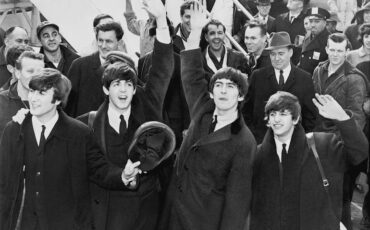 The Beatles arriving at John F. Kennedy International Airport, 7 February 1964. Public Domain via Wikimedia Commons.