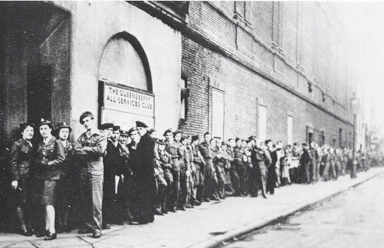  Queuing outside the Queensbury Club during World War II. Photo Credit: © Imperial War Museum. 