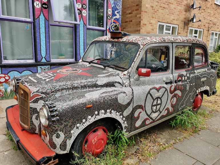 Black Cab in front of Carrie Reichardt Mosaic House, Chiswick area of London. Photo Credit: © Christopher Hayden.