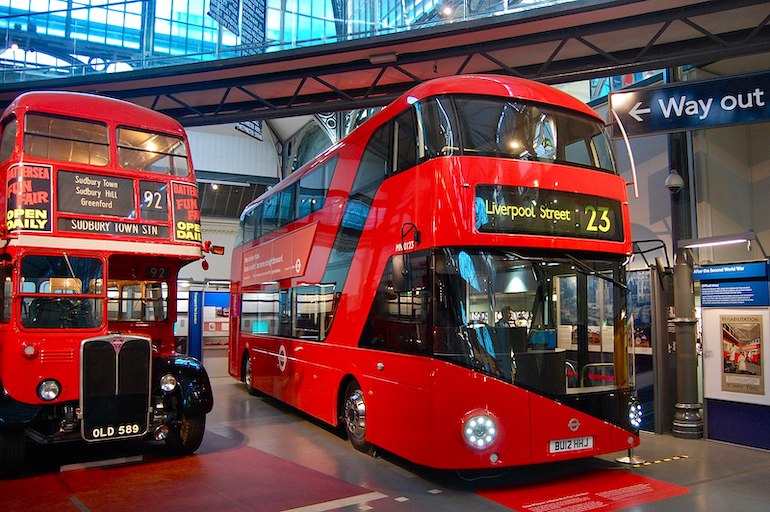 A New Routemaster bus alongside a 1954 AEC Regent III RT inside the London Transport Museum. Photo Credit: © Magnus D via Wikimedia Commons. 