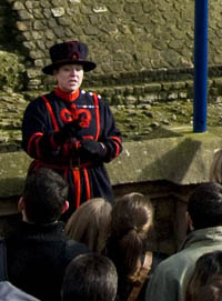 Lady Beefeater Moira Cameron at the Tower of London. Photo Credit: © Joshd via Wikimedia Commons.