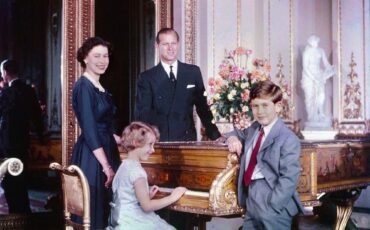 Prince Charles with his parents and sister Princess Anne, October 1957. Photo Credit: © Library and Archives Canada, e010949328 / Bibliothèque et Archives Canada, e010949328 via Wikimedia Commons.