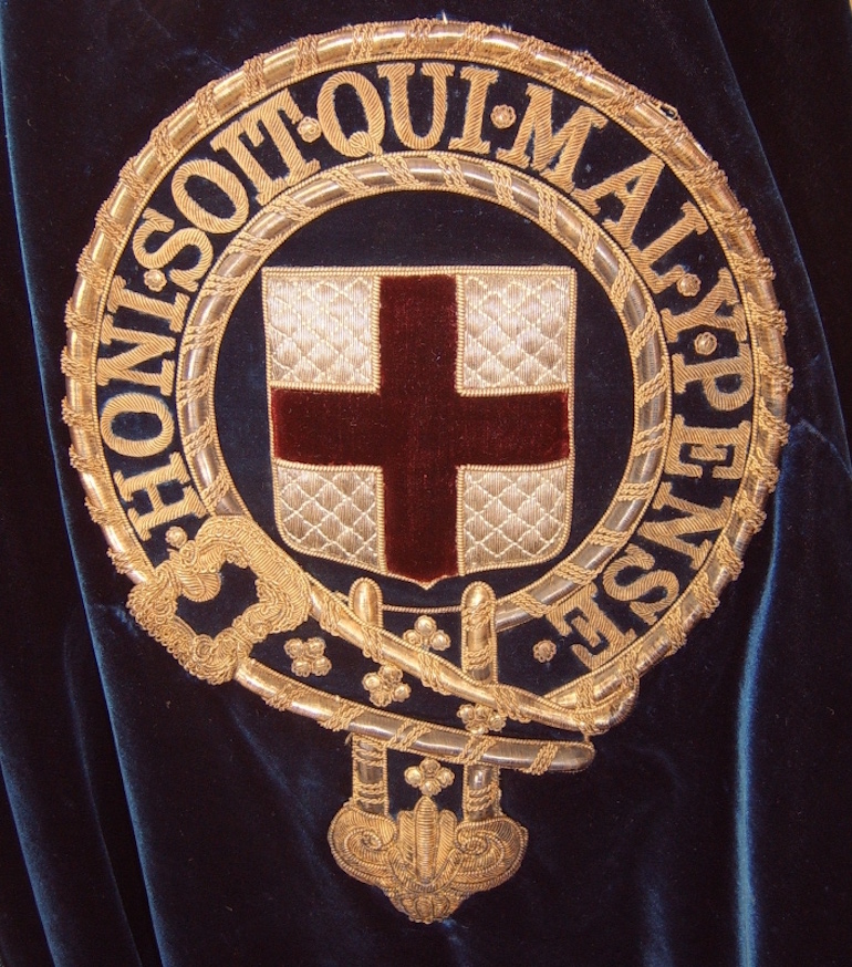Badge of the Order embroidered onto the left shoulder of a Knight's blue velvet mantle. Photo Credit: © Nicholas Jackson via Wikimedia Commons.