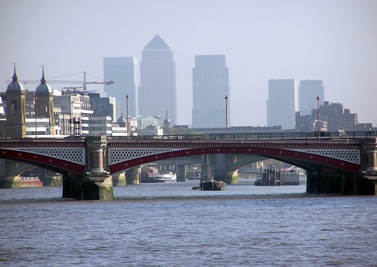 Blackfriars Bridge, seen from Waterloo Bridge in London. Photo Credit: © Public Domain via Wikimedia Commons.