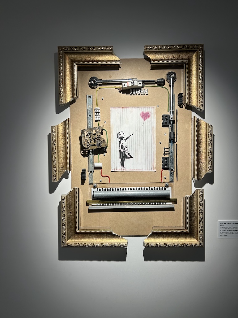 Girl with Balloon painting renamed Love Is in the Bin by Banksy. Photo Credit: © Edwin Lerner. 